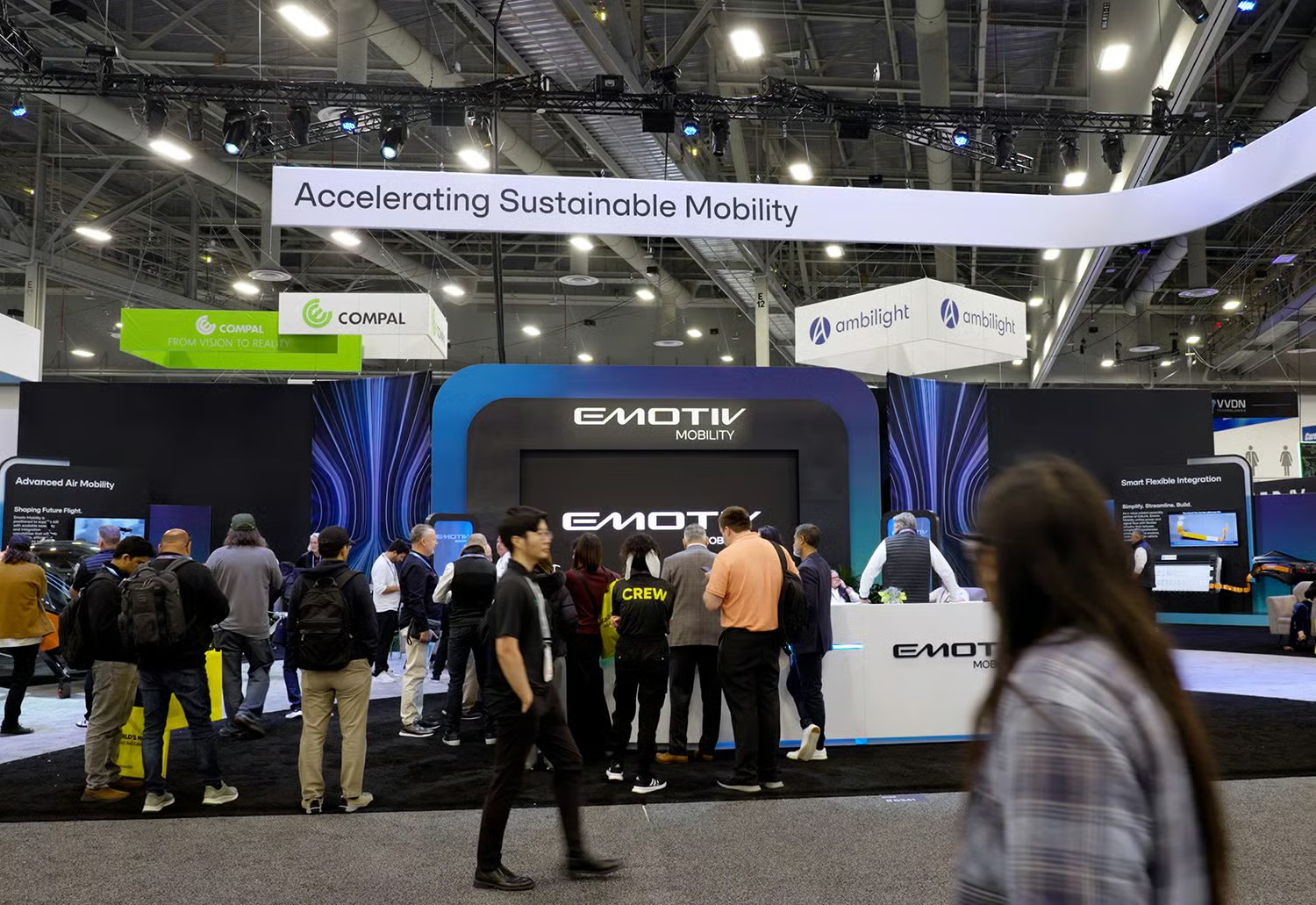 The Emotiv booth at CES: the Nexus hub under the canopy line, a crowd at the desk