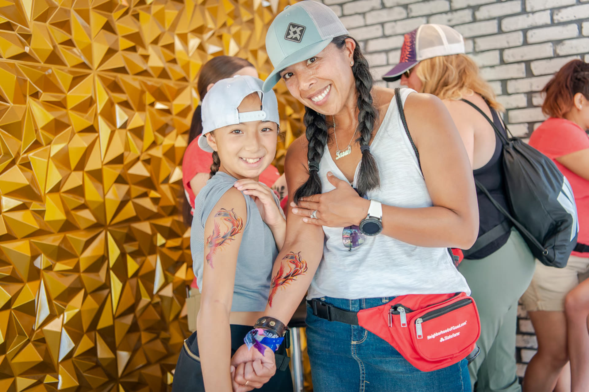 A mother and daughter at the gold wall