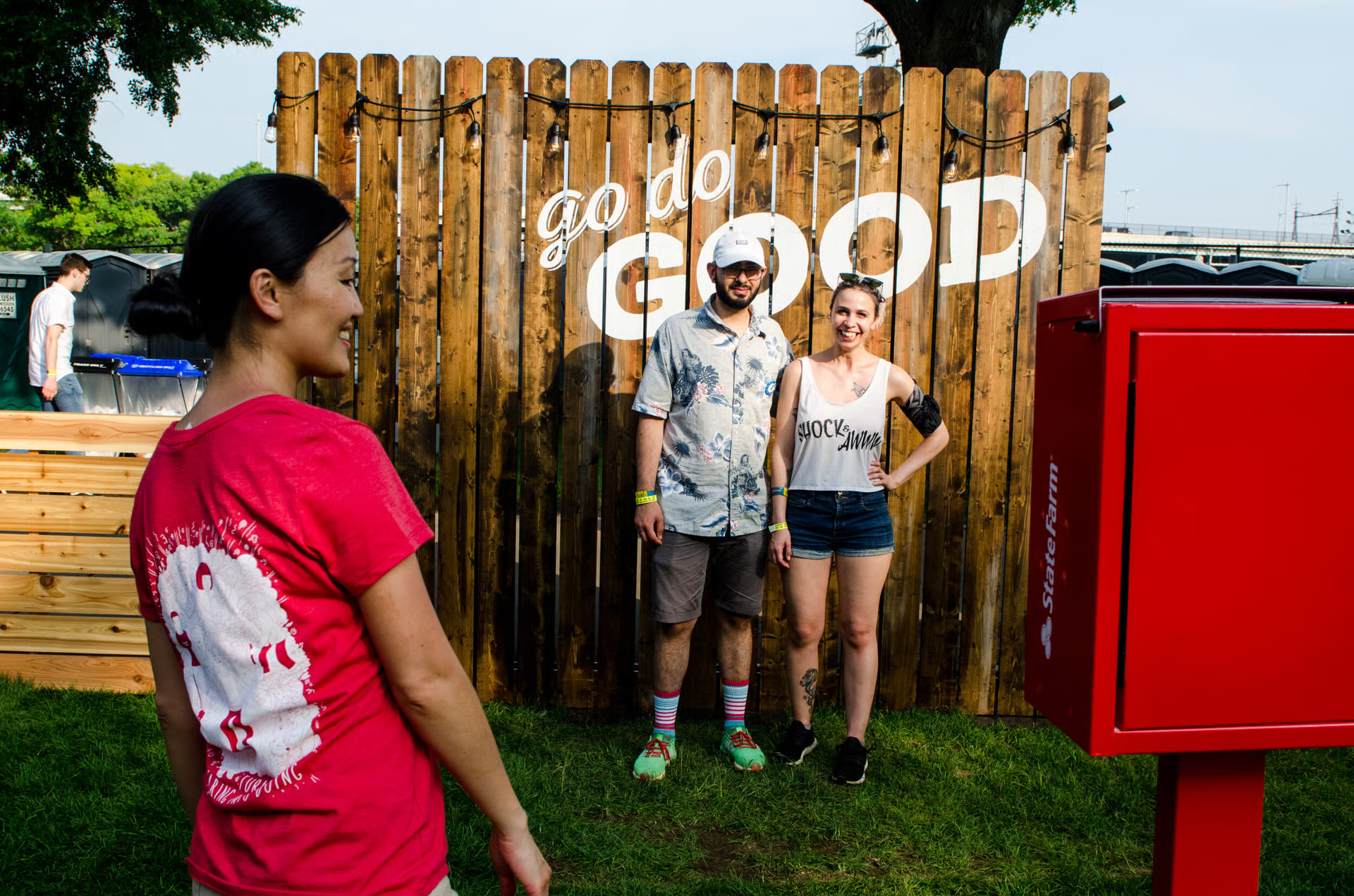 Festivalgoers at the Go Do Good fence